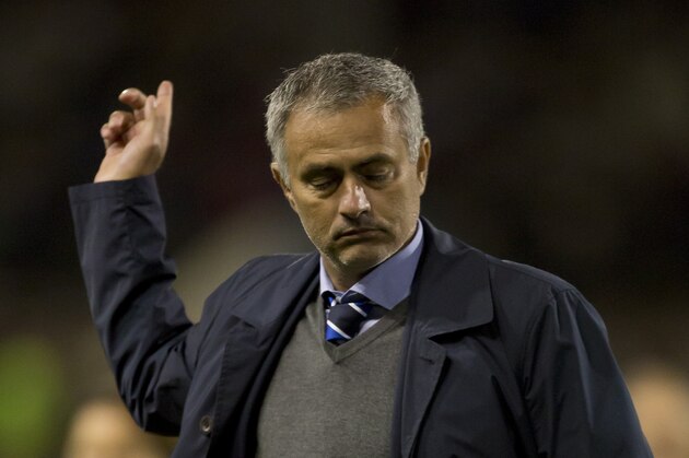 Chelsea's manager Jose Mourinho gestures as he walks from the pitch after his team's 3-1 win at Burnley in their English Premier League soccer match at Turf Moor Stadium, Burnley, England, Monday Aug. 18, 2014. (AP Photo/Jon Super)