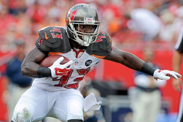 TAMPA, FL - SEPTEMBER 14: Bobby Rainey #43 of the Tampa Bay Buccaneers carries during the first quarter of the game against the St. Louis Rams at Raymond James Stadium on September 14, 2014 in Tampa, Florida.  (Photo by Cliff McBride/Getty Images)