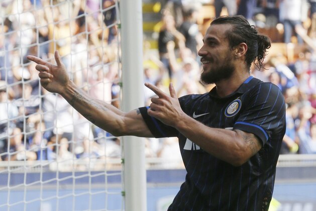 Inter Milan forward Pablo Daniel Osvaldo celebrates after scoring his side's fourth goal during a Serie A soccer match between Inter Milan and Sassuolo, at the San Siro stadium in Milan, Italy, Sunday, Sept.14, 2014. (AP Photo/Luca Bruno)