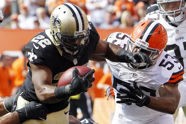 Sep 14, 2014; Cleveland, OH, USA; New Orleans Saints running back Mark Ingram (22) scores a touchdown against Cleveland Browns inside linebacker Craig Robertson (53) during the fourth quarter at FirstEnergy Stadium. The Browns won 26-24. Mandatory Credit: Ron Schwane-USA TODAY Sports