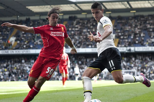 Tottenham Hotspur's Erik Lamela, right, vies for the ball with Liverpool's Lazar Markovic, during their English Premier League soccer match at White Hart Lane, London, Sunday, Aug. 31, 2014 (AP Photo/Bogdan Maran)