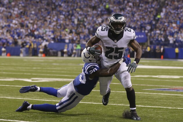 Philadelphia Eagles running back LeSean McCoy (25) is tackled by Indianapolis Colts free safety Darius Butler (20) during the first half of an NFL football game Monday, Sept. 15, 2014, in Indianapolis. (AP Photo/Michael Conroy)