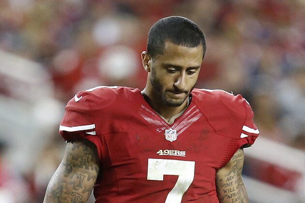 San Francisco 49ers quarterback Colin Kaepernick (7) walks on the field during the fourth quarter of an NFL football game against the Chicago Bears in Santa Clara, Calif., Sunday, Sept. 14, 2014. (AP Photo/Tony Avelar)
