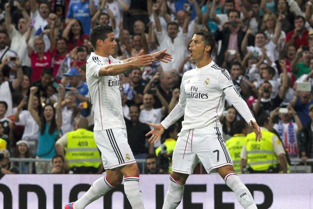 Real Madrid’s Cristiano Ronaldo, right, celebrates his goal with teammate James Rodriguez during a Spanish La Liga soccer match against Atletico de Madrid at the Santiago Bernabeu stadium in Madrid, Spain, Saturday, Sept. 13, 2014. (AP Photo/Gabriel Pecot) Real Madrid’s Cristiano Ronaldo, right, celebrates his goal with teammate James Rodriguez during a Spanish La Liga soccer match against Atletico de Madrid at the Santiago Bernabeu stadium in Madrid, Spain, Saturday, Sept. 13, 2014. (AP Photo/Gabriel Pecot)