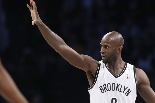 Brooklyn Nets forward Kevin Garnett (2) gestures to the crowd in the first half of their NBA basketball game against the Denver Nuggets at the Barclays Center, Tuesday, Dec. 3, 2013 in New York. (AP Photo/Kathy Willens)