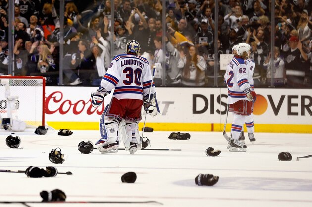 LOS ANGELES, CA - JUNE 13:  Goaltender Henrik Lundqvist #30 and the New York Rangers stand on the ice dejected after the Los Angeles Kings won the Stanley Cup and Game Five in double overtime during the 2014 Stanley Cup Final at the Staples Center on June 13, 2014 in Los Angeles, California. The Kings won the series 4-1.  (Photo by Rebecca Taylor/NHLI via Getty Images)