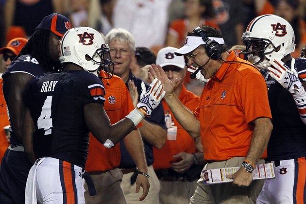 Auburn head coach Gus Malzahn celebrates with wide receiver Quan Bray (4) after he returned a punt for a touchdown during the first half of an NCAA college football game against San Jose State on Saturday, Sept. 6, 2014, in Auburn, Ala. (AP Photo/Butch Dill)