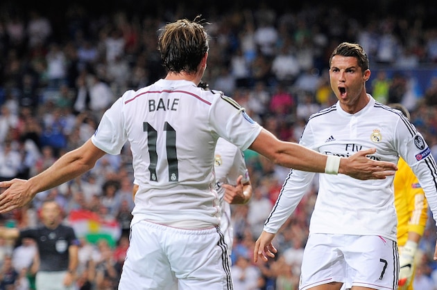 MADRID, SPAIN - SEPTEMBER 16:  Cristiano Ronaldo of Real Madrid celebrates with Gareth Bale after scoring Real's 3rd goal during the UEFA Champions League Group B match between Real Madrid CF and FC Basel 1893 on September 16, 2014 in Madrid, Spain.  (Photo by Denis Doyle/Getty Images)