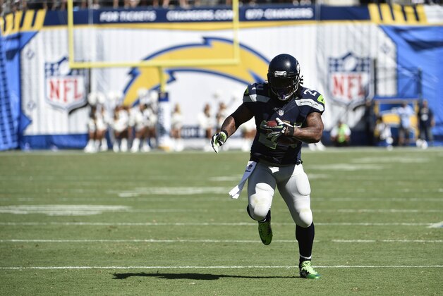 Seattle Seahawks running back Marshawn Lynch scores against the San Diego Chargers during the second half of an NFL football game on Sunday, Sept. 14, 2014, in San Diego. (AP Photo/Denis Poroy)