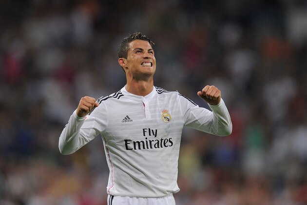 MADRID, SPAIN - AUGUST 25:  Cristiano Ronaldo of Real Madrid celebrates after scoring Real's 2nd goal during the La liga match between Real Madrid CF and Cordoba CF at Estadio Santiago Bernabeu on August 25, 2014 in Madrid, Spain.  (Photo by Denis Doyle/Getty Images)