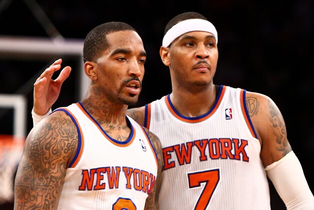Feb. 27, 2013; New York, NY, USA; New York Knicks small forward Carmelo Anthony (7) pats shooting guard J.R. Smith (8) on the back against the Golden State Warriors during the fourth quarter at Madison Square Garden. Knicks won 109-105. Mandatory Credit: Debby Wong-USA TODAY Sports