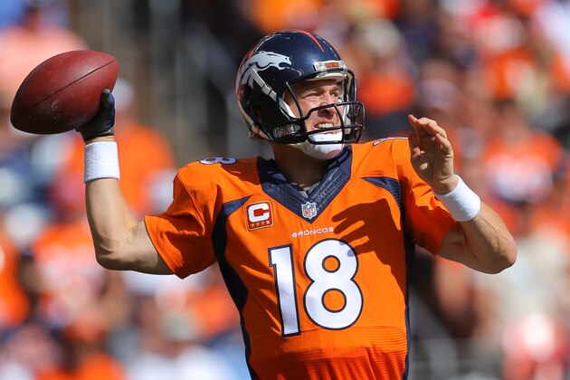 DENVER, CO - SEPTEMBER 14:  Quarterback Peyton Manning #18 of the Denver Broncos throws in the first quarter of a game against the Kansas City Chiefs at Sports Authority Field at Mile High on September 14, 2014 in Denver, Colorado.  (Photo by Justin Edmonds/Getty Images)