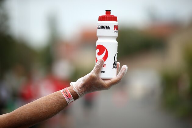 VICHY, FRANCE - AUGUST 31:  A drink bottle is offered at a water station during the Challenge Triathlon Vichy on August 31, 2014 in Vichy, France. (Photo by Stephen Pond/Getty Images for Challenge Triathlon)