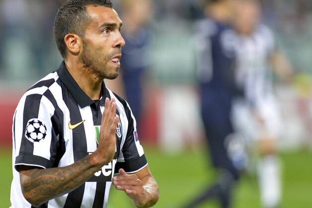 Juventus' Carlos Tevez celebrates after scoring his side's first goal during a Champions League, Group A soccer match between Juventus and Malmo, at the Juventus Stadium in Turin, Italy, Tuesday, Sept. 16, 2014. (AP Photo/Massimo Pinca)