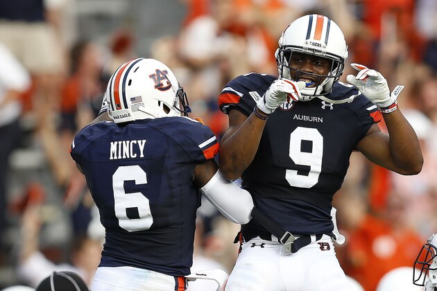 AUBURN, AL - AUGUST 30:  Defensive back Jermaine Whitehead #9 of the Auburn Tigers celebrates his interception for a touchdown with defensive back Jonathan Mincy #6 during the game against the Arkansas Razorbacks at Jordan Hare Stadium on August 30, 2014 in Auburn, Alabama.  (Photo by Mike Zarrilli/Getty Images)
