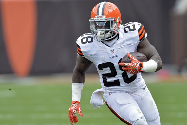 Cleveland Browns running back Terrance West runs against the New Orleans Saints in the first quarter of an NFL football game Sunday, Sept. 14, 2014, in Cleveland. (AP Photo/David Richard)