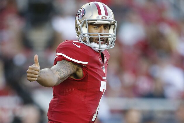 San Francisco 49ers quarterback Colin Kaepernick (7) signals at the line of scrimmage during an NFL football game against the Chicago Bears in Santa Clara, Calif., Sunday, Sept. 14, 2014. (AP Photo/Tony Avelar)