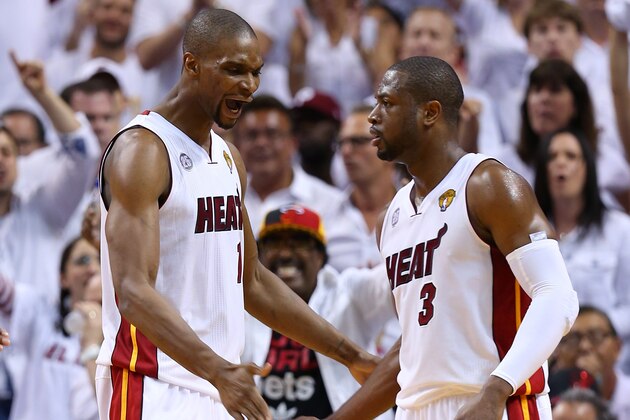 MIAMI, FL - JUNE 20: Chris Bosh #1 and Dwyane Wade #3 of the Miami Heat celebrate in the second quarter while taking on the San Antonio Spurs during Game Seven of the 2013 NBA Finals at AmericanAirlines Arena on June 20, 2013 in Miami, Florida. NOTE TO USER: User expressly acknowledges and agrees that, by downloading and or using this photograph, User is consenting to the terms and conditions of the Getty Images License Agreement. (Photo by Mike Ehrmann/Getty Images) MIAMI, FL - JUNE 20: Chris Bosh #1 and Dwyane Wade #3 of the Miami Heat celebrate in the second quarter while taking on the San Antonio Spurs during Game Seven of the 2013 NBA Finals at AmericanAirlines Arena on June 20, 2013 in Miami, Florida. NOTE TO USER: User expressly acknowledges and agrees that, by downloading and or using this photograph, User is consenting to the terms and conditions of the Getty Images License Agreement. (Photo by Mike Ehrmann/Getty Images)