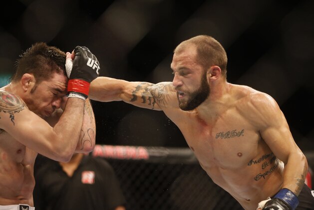 Sam Sicilia, right, from the U.S., fights Rony Mariano Bezzerra, from Brazil, during their featherweight mixed martial arts bout at the Ultimate Fighting Championship (UFC) 153 in Rio de Janeiro, Brazil, Saturday Oct.  13, 2012. Bezzerra defeated Sicilia. (AP Photo/Felipe Dana)