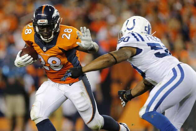 Denver Broncos running back Montee Ball (28) stiff arms Indianapolis Colts inside linebacker Jerrell Freeman (50) during the second half of an NFL football game, Sunday, Sept. 7, 2014, in Denver. (AP Photo/Joe Mahoney)