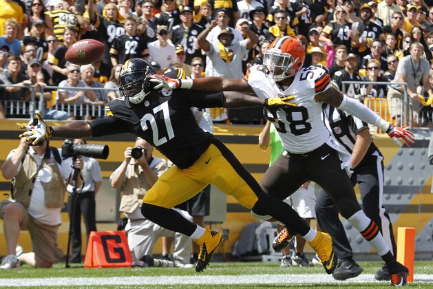 Sep 7, 2014; Pittsburgh, PA, USA; Pittsburgh Steelers running back LeGarrette Blount (27) reaches for a pass in the end zone against Cleveland Browns outside linebacker Christian Kirksey (58) during the first quarter at Heinz Field. The pass fell incomplete. The Steelers won 30-27. Mandatory Credit: Charles LeClaire-USA TODAY Sports