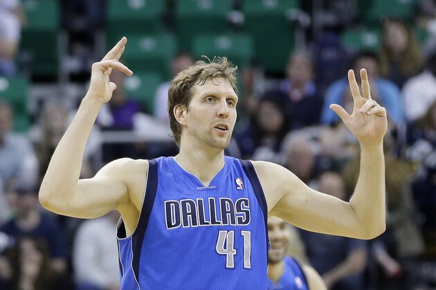 Dallas Mavericks' Dirk Nowitzki (41) celebrates his 3 pointer in the second half during an NBA basketball game against the Utah Jazz Tuesday, April 8, 2014, in Salt Lake City. (AP Photo/Rick Bowmer)