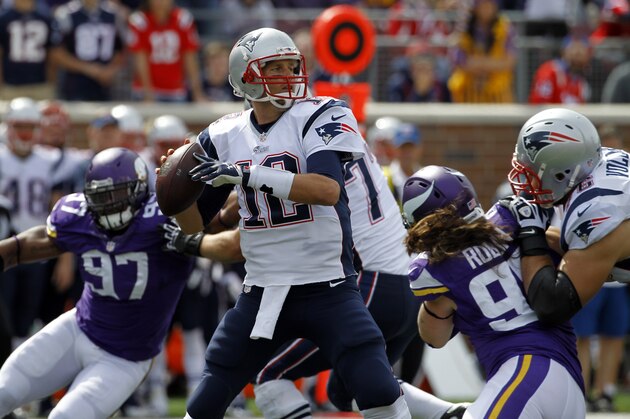New England Patriots quarterback Tom Brady throws during the second quarter of an NFL football game against the Minnesota Vikings Sunday, Sept. 14, 2014, in Minneapolis. (AP Photo/Ann Heisenfelt)