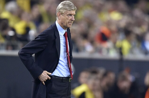 Arsenal's head coach Arsene Wenger attends the Champions League group D soccer match between Borussia Dortmund and Arsenal in Dortmund, Germany, Tuesday, Sept.16,2014. (AP Photo/Martin Meissner)