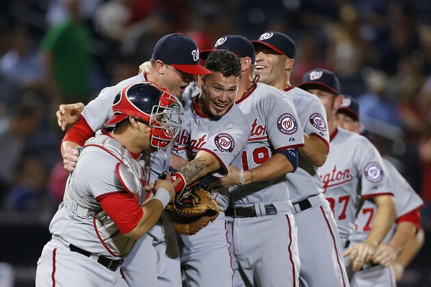 ATLANTA, GA - SEPTEMBER 16:  Members of the Washington Nationals celebrate after the division-clinching game against the Atlanta Braves at Turner Field on September 16, 2014 in Atlanta, Georgia.  (Photo by Mike Zarrilli/Getty Images)