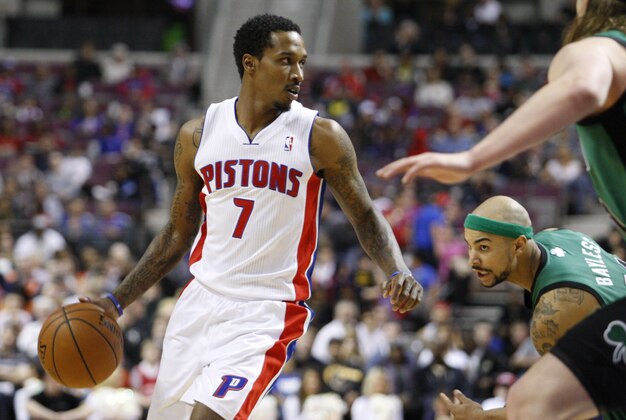 Apr 5, 2014; Auburn Hills, MI, USA; Detroit Pistons guard Brandon Jennings (7) dribbles the ball against Boston Celtics guard Jerryd Bayless (11) during the third quarter at The Palace of Auburn Hills. Pistons beat the Celtics 115-111. Mandatory Credit: Raj Mehta-USA TODAY Sports