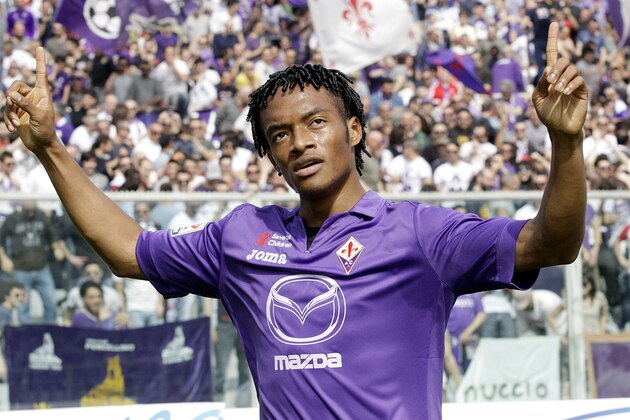Fiorentina's Juan Cuadrado celebrates after scoring during a Serie A soccer match between Fiorentina and Udinese  at the Artemio Franchi stadium in Florence, Italy, Sunday, April 6 2014. (AP Photo/Fabrizio Giovannozzi)