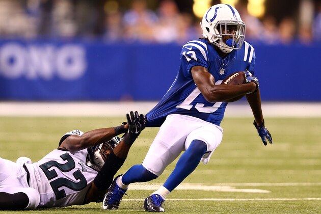 INDIANAPOLIS, IN - SEPTEMBER 15:  Wide receiver T.Y. Hilton #13 of the Indianapolis Colts is tackled by cornerback Brandon Boykin #22 of the Philadelphia Eagles during a game at Lucas Oil Stadium on September 15, 2014 in Indianapolis, Indiana.  (Photo by Andy Lyons/Getty Images)