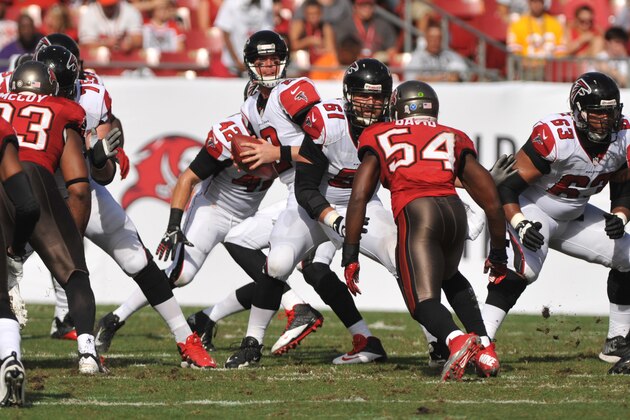 TAMPA, FL -  NOVEMBER 17:  Quarterback Matt Ryan #2 of the Atlanta Falcons sets to pass behind the block of center Joe Hawley #61 against the Tampa Bay Buccaneers November 17, 2013 at Raymond James Stadium in Tampa, Florida. Tampa won 41- 28. (Photo by Al Messerschmidt/Getty Images)
