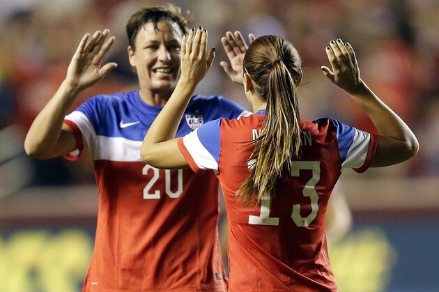 United States Alex Morgan (13) celebrates with Abby Wambach (20) after scoring in the first half of an international friendly game with Mexico at Rio Tinto Stadium, Saturday, Sept. 13, 2014, in Sandy, Utah. AP Photo/Rick Bowmer)