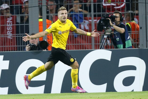 Dortmund's Ciro Immobile celebrates his side's opening goal during the Champions League group D soccer match between Borussia Dortmund and Arsenal in Dortmund, Germany, Tuesday, Sept.16,2014. (AP Photo/Frank Augstein)