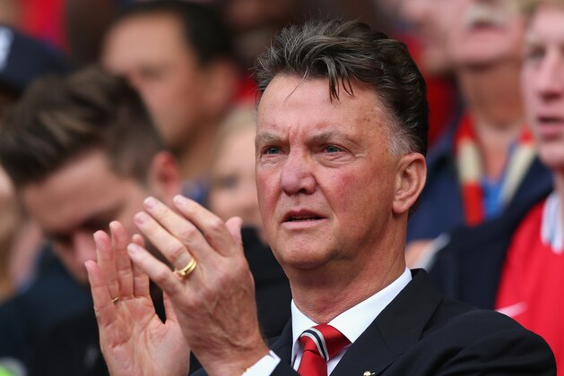 MANCHESTER, ENGLAND - SEPTEMBER 14:  Manchester United Manager Louis van Gaal applauds prior to the Barclays Premier League match between Manchester United and Queens Park Rangers at Old Trafford on September 14, 2014 in Manchester, England.  (Photo by Alex Livesey/Getty Images)