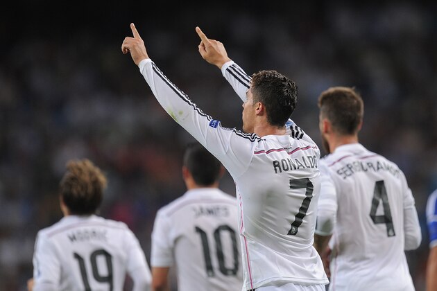 MADRID, SPAIN - SEPTEMBER 16:  Cristiano Ronaldo of Real Madrid celebrates after scoring Real's 3rd goal during the UEFA Champions League Group B match between Real Madrid CF and FC Basel 1893 on September 16, 2014 in Madrid, Spain.  (Photo by Denis Doyle/Getty Images)