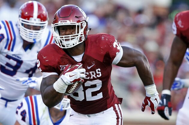FILE - In this Aug. 30, 2014, file photo ,Oklahoma running back Samaje Perine (32) carries the ball during an NCAA college football game against Louisiana Tech in Norman, Okla. Perine has been a key to No. 4 Oklahoma’s solid ground attack. The 5-foot-10, 243-pound bulldozer is the No. 2 rusher for the Sooners, and he’ll carry a greater load as top rusher Keith Ford recovers from a fractured right fibula. (AP Photo/Sue Ogrocki, File)