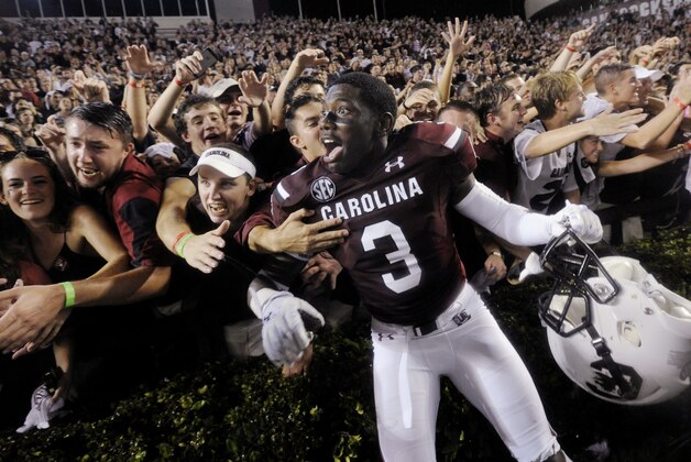 South Carolina cornerback Chris Lammons (3) celebrates with fans in the student section after South Carolina defeated Georgia 38-35 during an NCAA college football game Saturday, Sept. 13, 2014, in Columbia, S.C. (AP Photo/Rainier Ehrhardt)