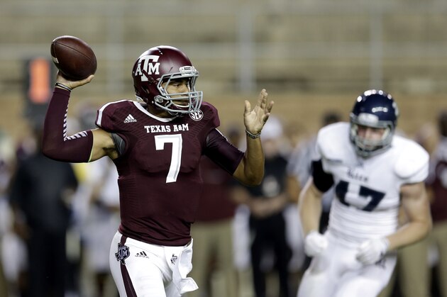 Texas A&M quarterback Kenny Hill (7) throws a pass against Rice during the first quarter of an NCAA college football game Saturday, Sept. 13, 2014, in College Station, Texas. (AP Photo/David J. Phillip)