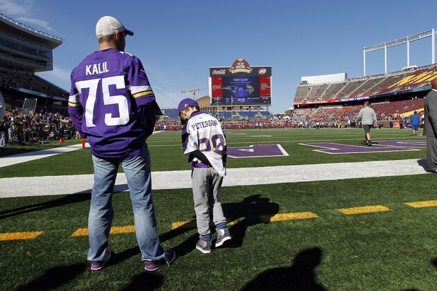 A boy wears an Adrian Peterson jersey before the start of an NFL football game between the Minnesota Vikings and the New England Patriots, Sunday, Sept. 14, 2014, in Minneapolis. Peterson was indicted in Texas on Friday for using a branch to spank one of his sons. He turned himself in early Saturday at a jail in Montgomery County, was processed and released, and deactivated by the Vikings for Sunday's game. (AP Photo/Ann Heisenfelt) A boy wears an Adrian Peterson jersey before the start of an NFL football game between the Minnesota Vikings and the New England Patriots, Sunday, Sept. 14, 2014, in Minneapolis. Peterson was indicted in Texas on Friday for using a branch to spank one of his sons. He turned himself in early Saturday at a jail in Montgomery County, was processed and released, and deactivated by the Vikings for Sunday's game. (AP Photo/Ann Heisenfelt)