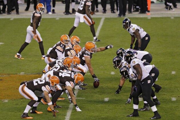 Cleveland Browns center Alex Mack (55) calls out the blocking against the Baltimore Ravens in the second quarter of an NFL football game Sunday, Nov. 3, 2013, in Cleveland. (AP Photo/Tony Dejak)