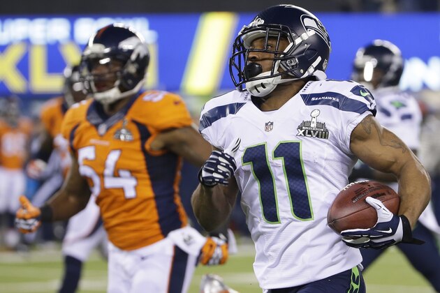 Seattle Seahawks' Percy Harvin (11) returns a kickoff 87-yards for a touchdown during the second half of the NFL Super Bowl XLVIII football game against the Denver Broncos Sunday, Feb. 2, 2014, in East Rutherford, N.J. (AP Photo/Matt Slocum)