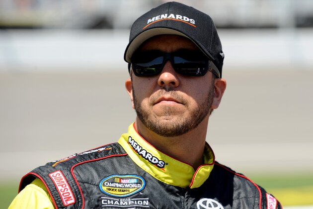 BROOKLYN, MI - AUGUST 16:  Matt Crafton, driver of the #88 Great Lakes Flooring/Menards Toyota, stands on the grid before the start of the NASCAR Camping World Truck Series Careers For Veterans 200 at Michigan International Speedway on August 16, 2014 in Brooklyn, Michigan.  (Photo by Robert Reiners/Getty Images)
