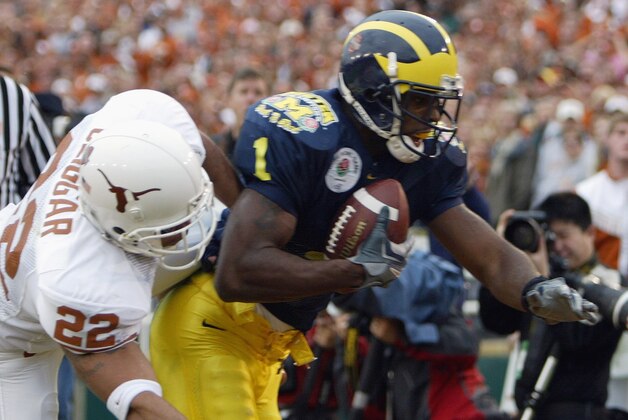 Michigan receiver Braylon Edwards (1) pulls in a second-quarter touchdown pass over Texas' Phillip Geiggar (22) at the Rose Bowl in Pasadena, Calif., Saturday, Jan. 1, 2005. (AP Photo/Chris Carlson) Michigan receiver Braylon Edwards (1) pulls in a second-quarter touchdown pass over Texas' Phillip Geiggar (22) at the Rose Bowl in Pasadena, Calif., Saturday, Jan. 1, 2005. (AP Photo/Chris Carlson)