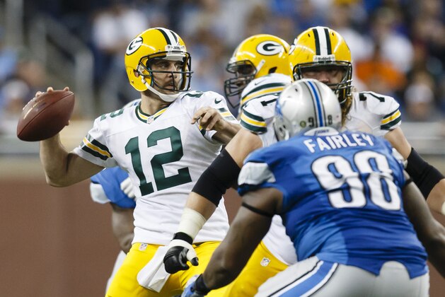 Green Bay Packers quarterback Aaron Rodgers (12) passes the ball against the Detroit Lions in the second half of an NFL football game at Ford Field in Detroit, Sunday, Nov. 18, 2012. Green Bay won 24-20. (AP Photo/Rick Osentoski)