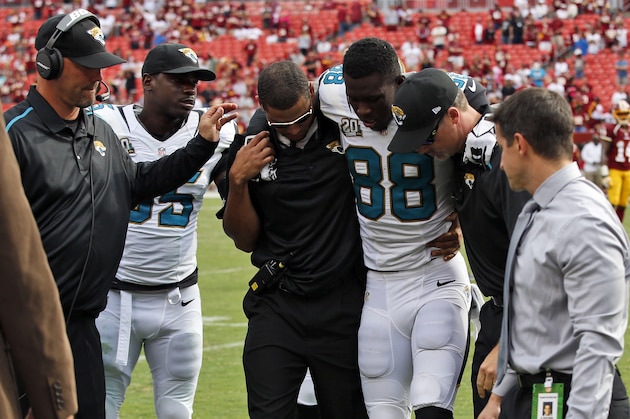 Jacksonville Jaguars wide receiver Allen Hurns (88) is helped off the field after he was injured during the second half of an NFL football game against the Washington Redskins Sunday, Sept. 14, 2014, in Landover, Md. The Redskins won 41-10. (AP Photo/Evan Vucci)