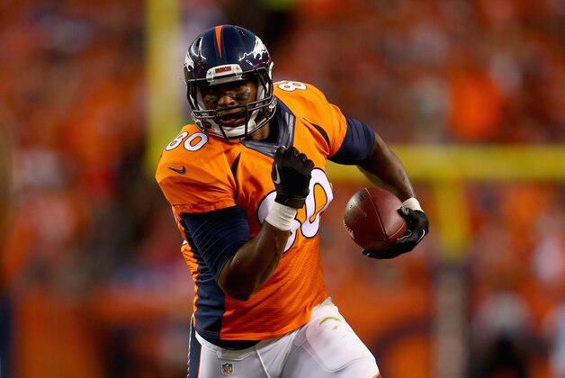 DENVER, CO - SEPTEMBER 07:  Tight end Julius Thomas #80 of the Denver Broncos carries the ball against the Indianapolis Colts at Sports Authority Field at Mile High on September 7, 2014 in Denver, Colorado.  (Photo by Jeff Gross/Getty Images)