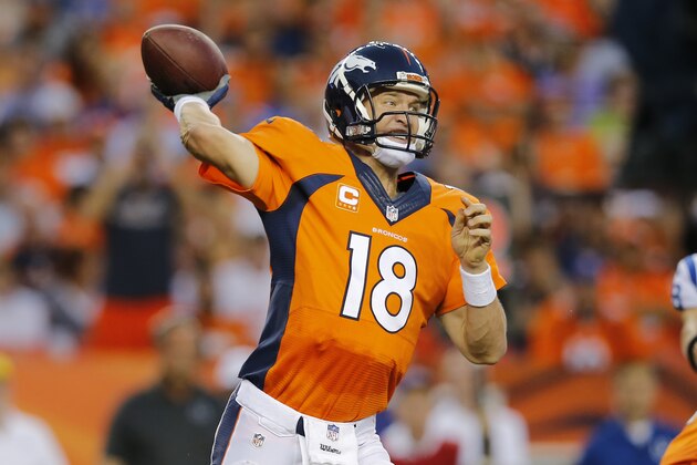 Denver Broncos quarterback Peyton Manning (18) throws against the Indianapolis Colts during the first half of an NFL football game, Sunday, Sept. 7, 2014, in Denver. (AP Photo/Jack Dempsey)