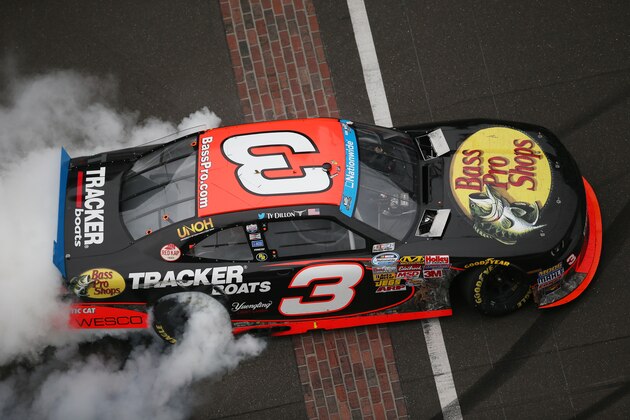 INDIANAPOLIS, IN - JULY 26:  Ty Dillon, driver of the #3 Bass Pro Shops Chevrolet, celebrates with a burnout after winning the NASCAR Nationwide Series Lilly Diabetes 250 at Indianapolis Motor Speedway on July 26, 2014 in Indianapolis, Indiana.  (Photo by Chris Graythen/Getty Images)